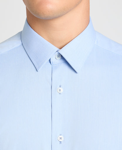 Man wearing a blue formal shirt