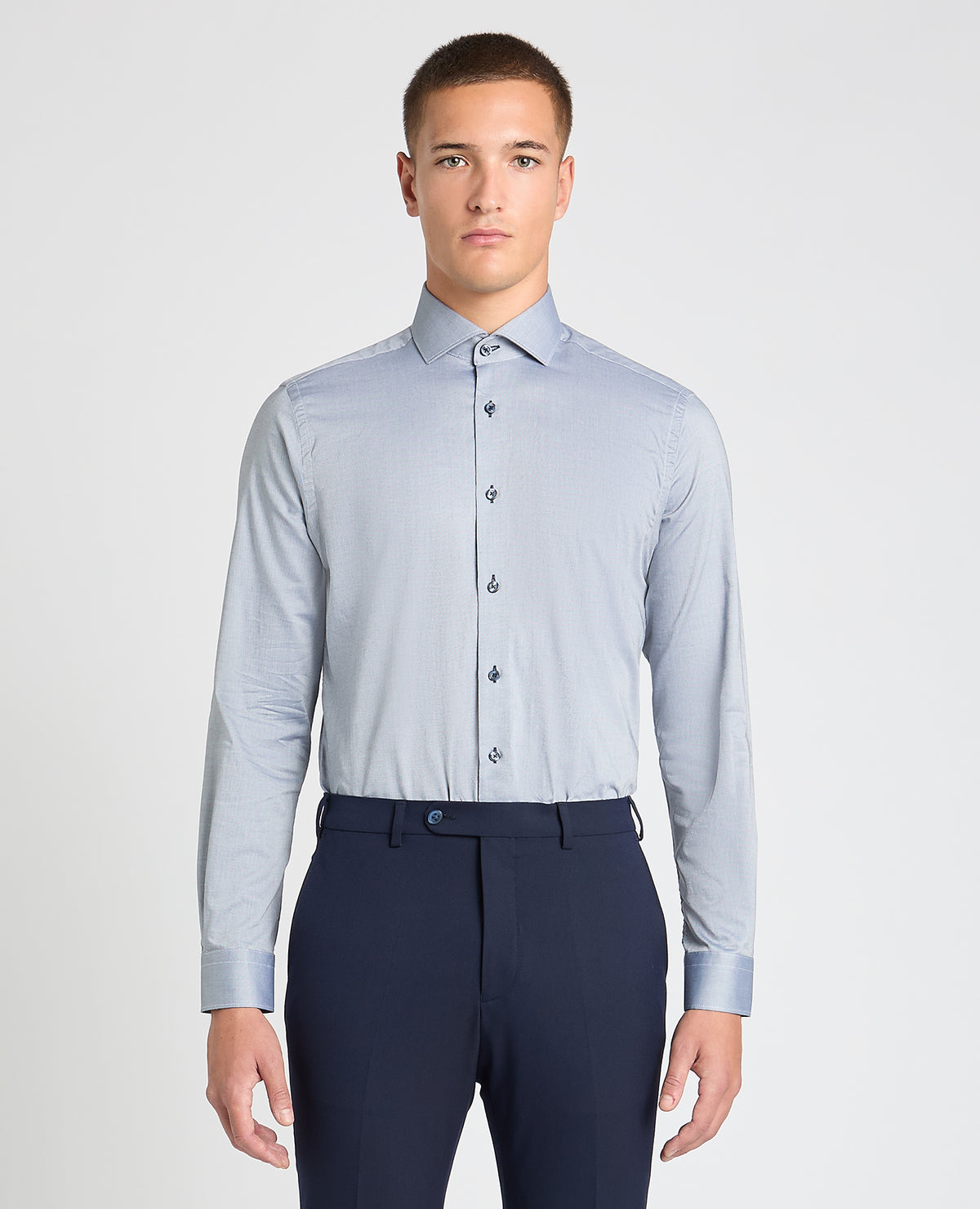 Man wearing a blue formal shirt