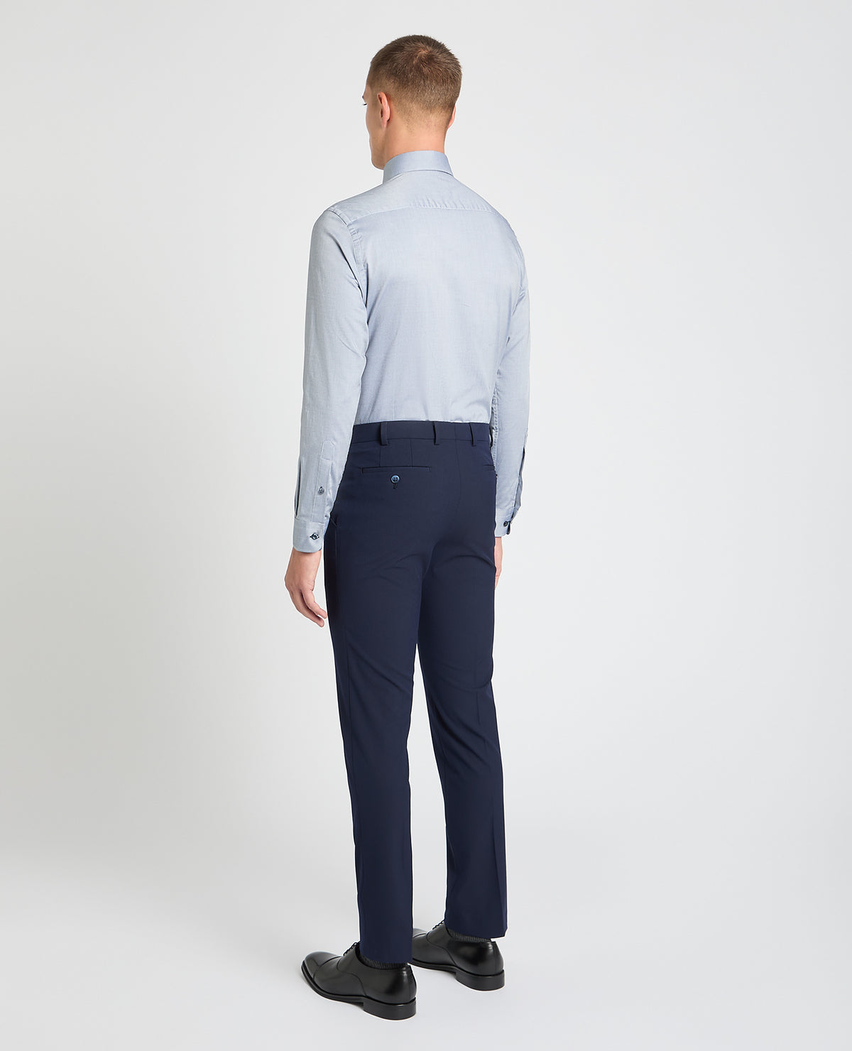 Man wearing a blue formal shirt