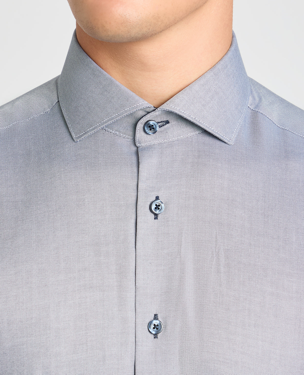 Man wearing a blue formal shirt