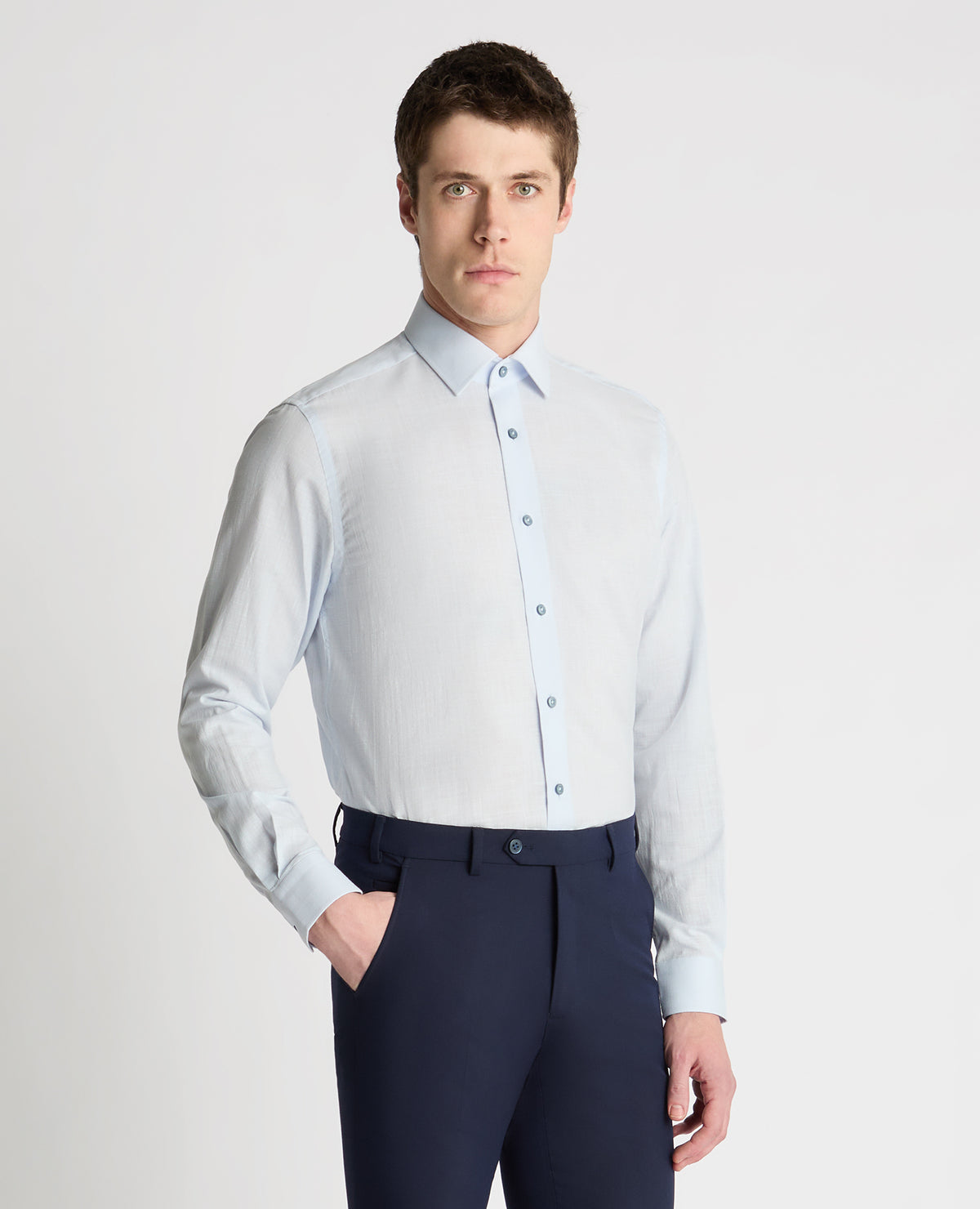 Man wearing a blue formal shirt