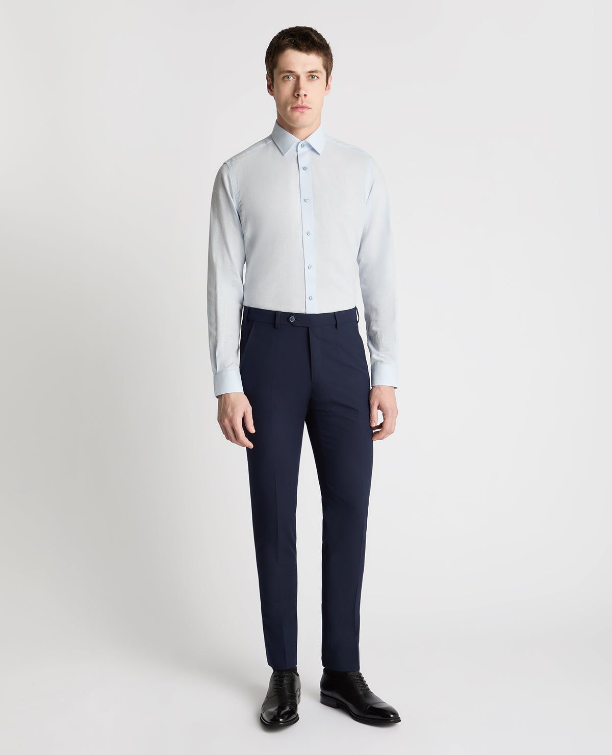 Man wearing a blue formal shirt