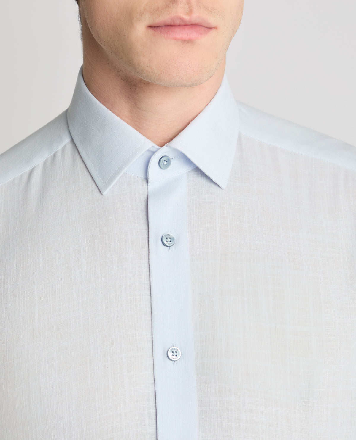 Man wearing a blue formal shirt