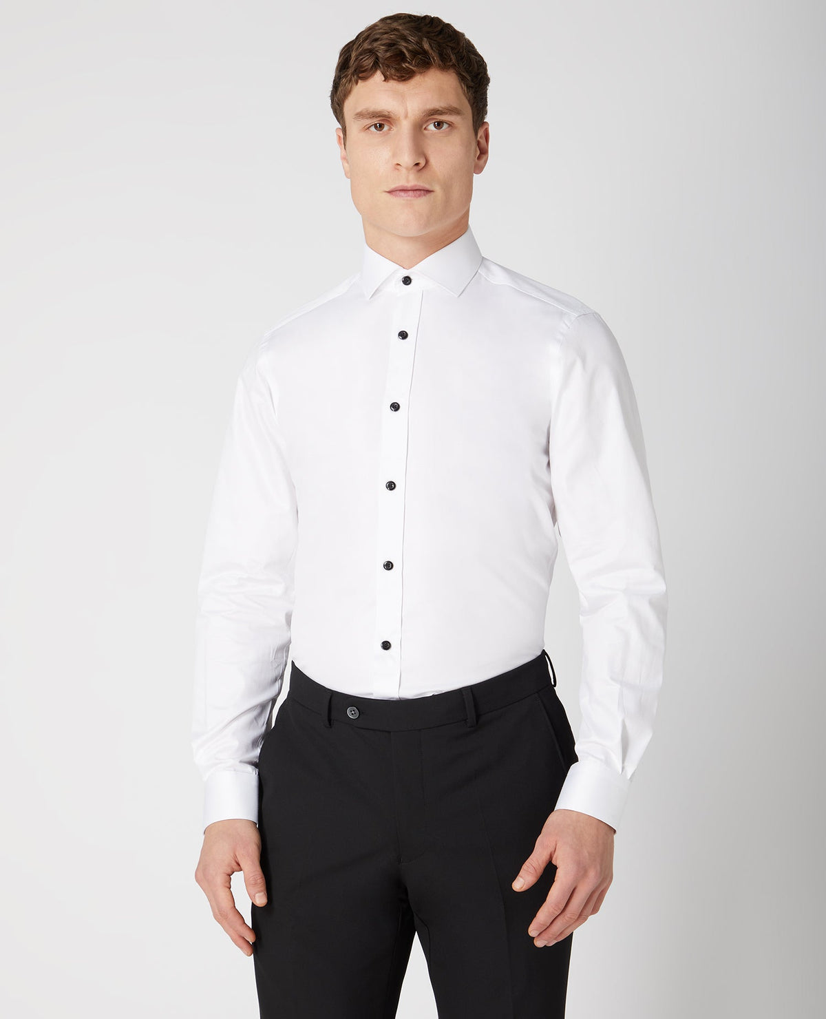Man wearing a white Tapered Fit Cotton Shirt