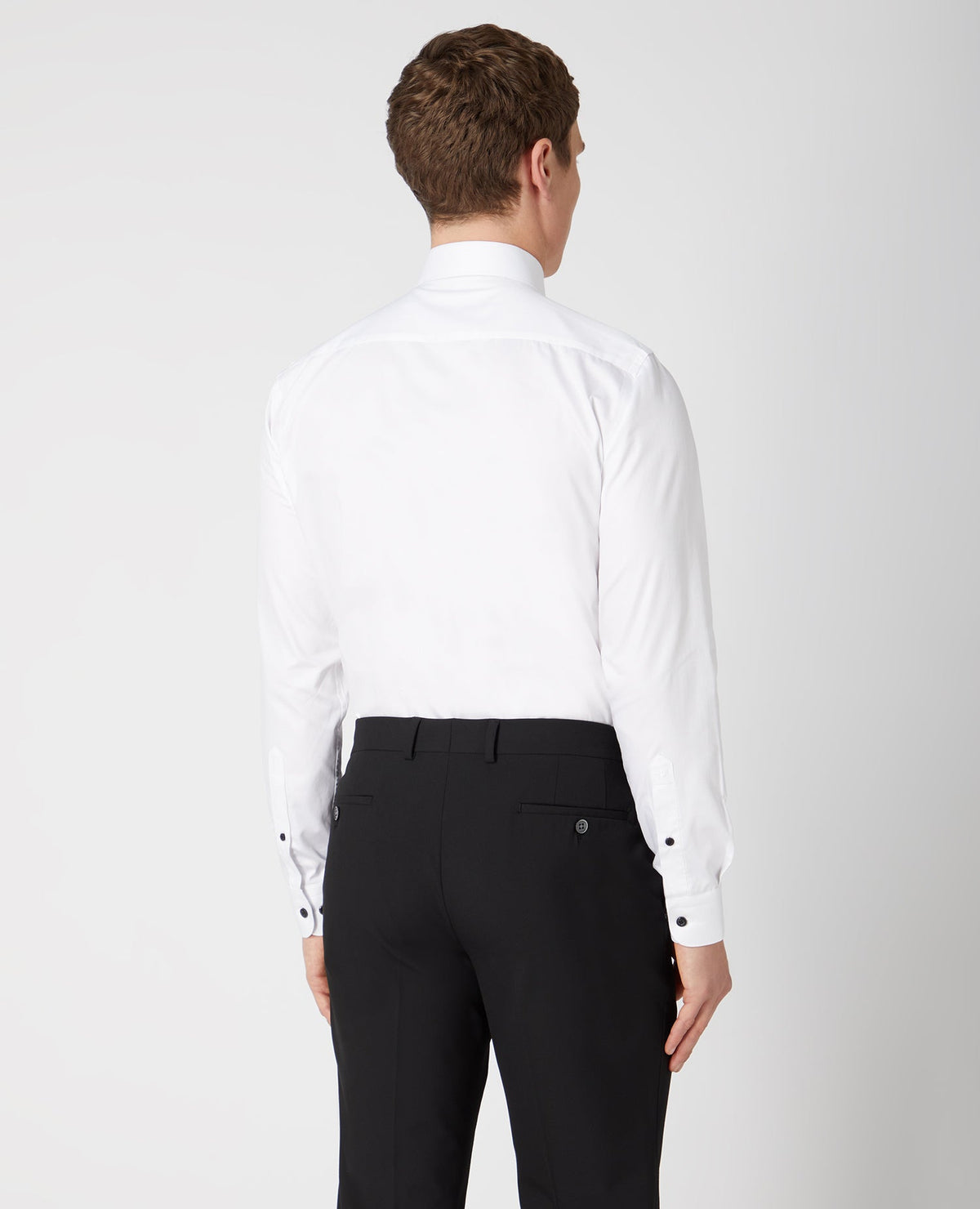 Man wearing a white Tapered Fit Cotton Shirt