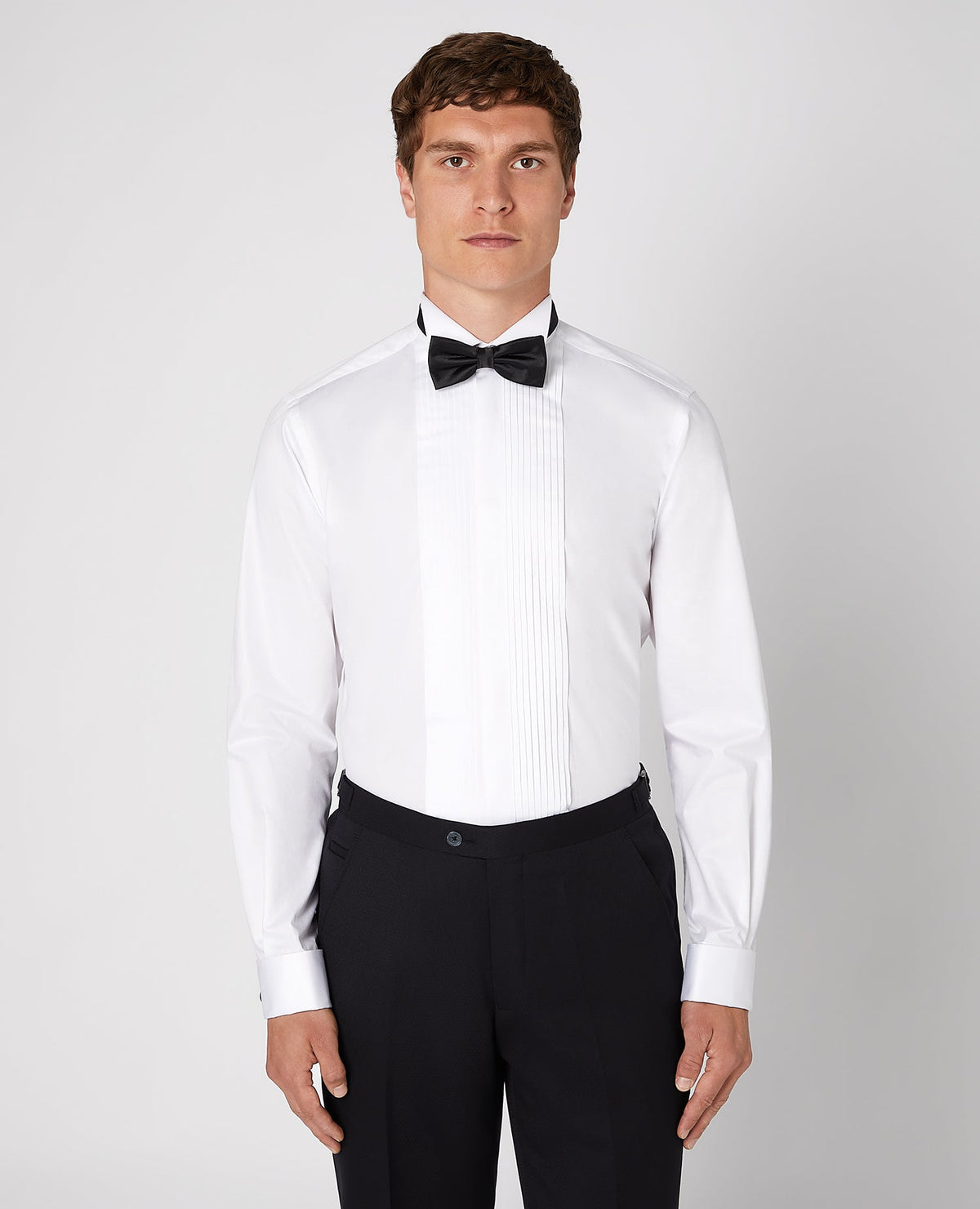 Man wearing a white Tapered Fit Cotton-Bend Shirt