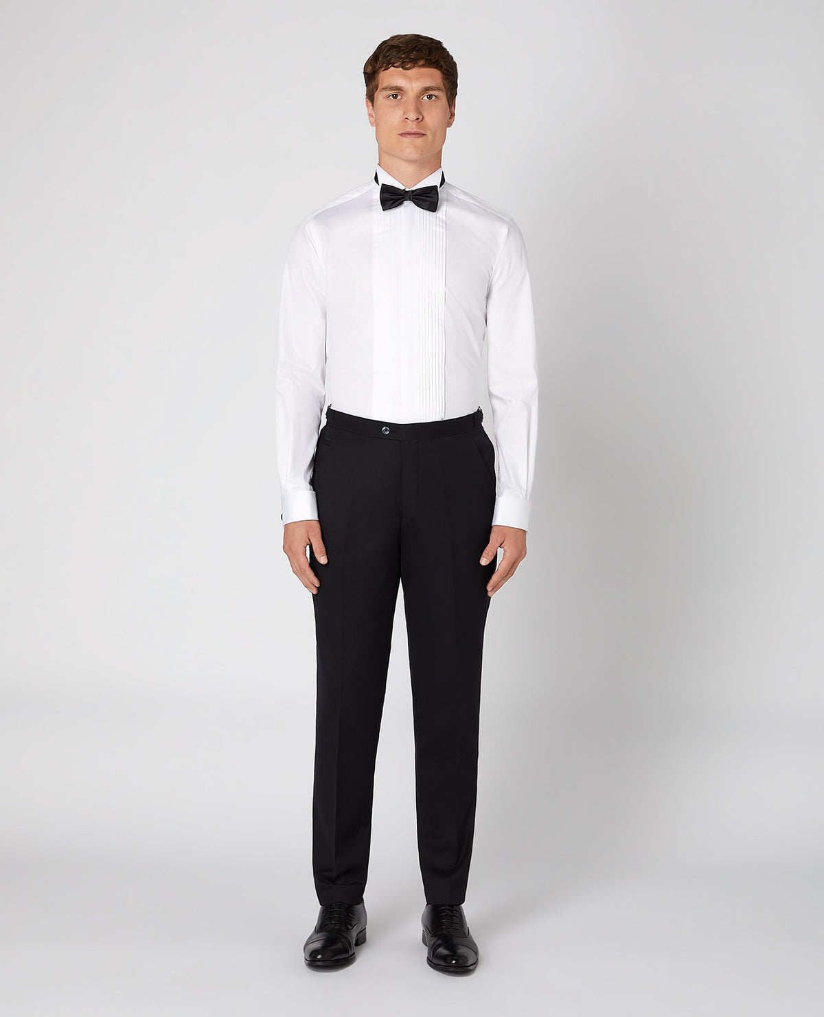Man wearing a white Tapered Fit Cotton-Bend Shirt