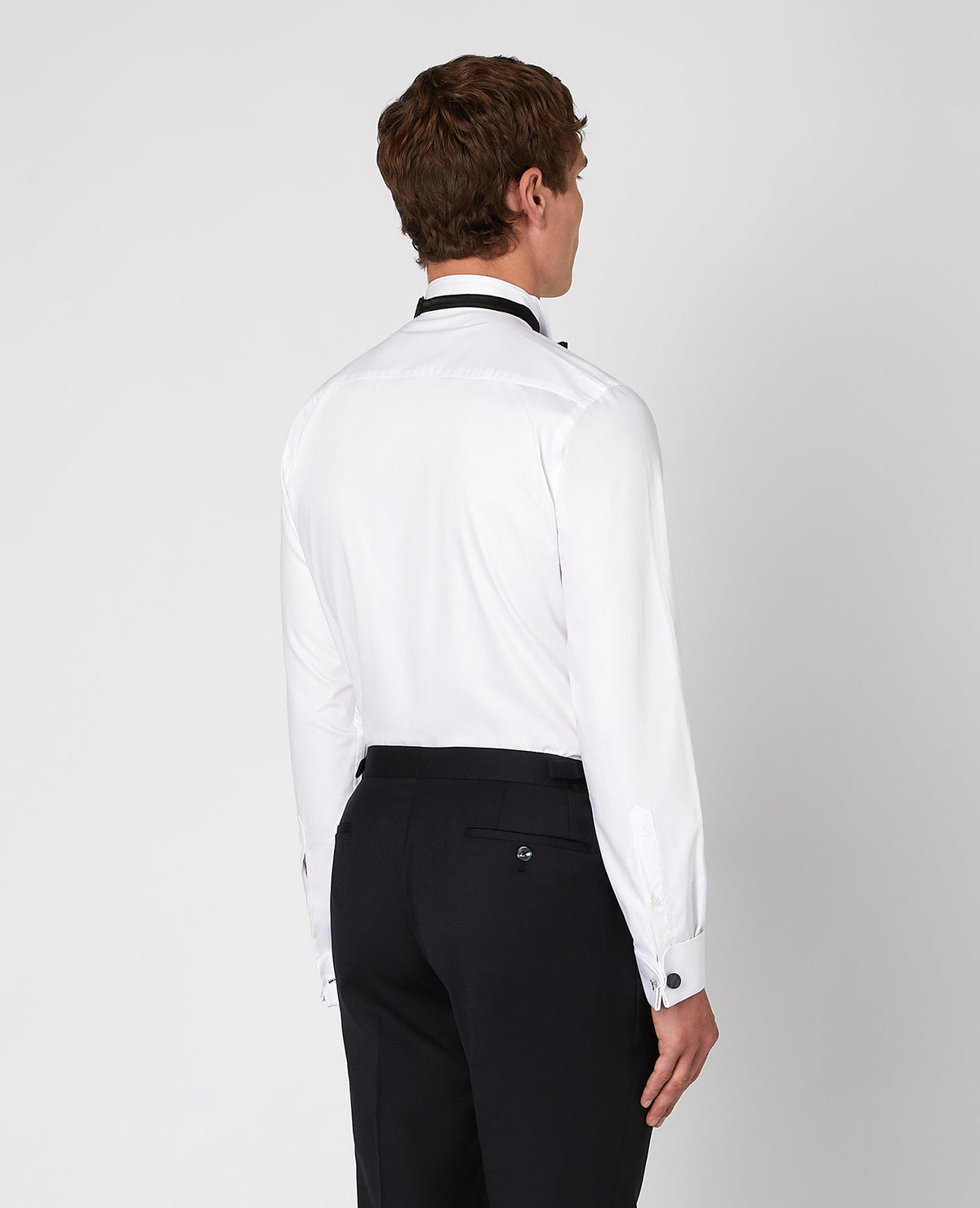 Man wearing a white Tapered Fit Cotton-Bend Shirt