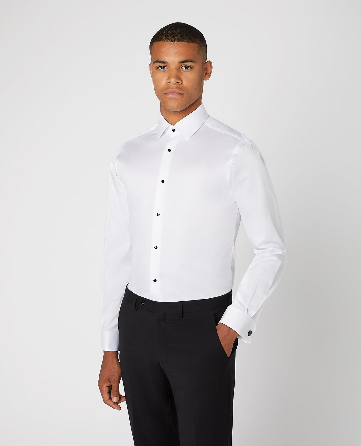 Man wearing a white Tapered Fit Cotton Evening Shirt