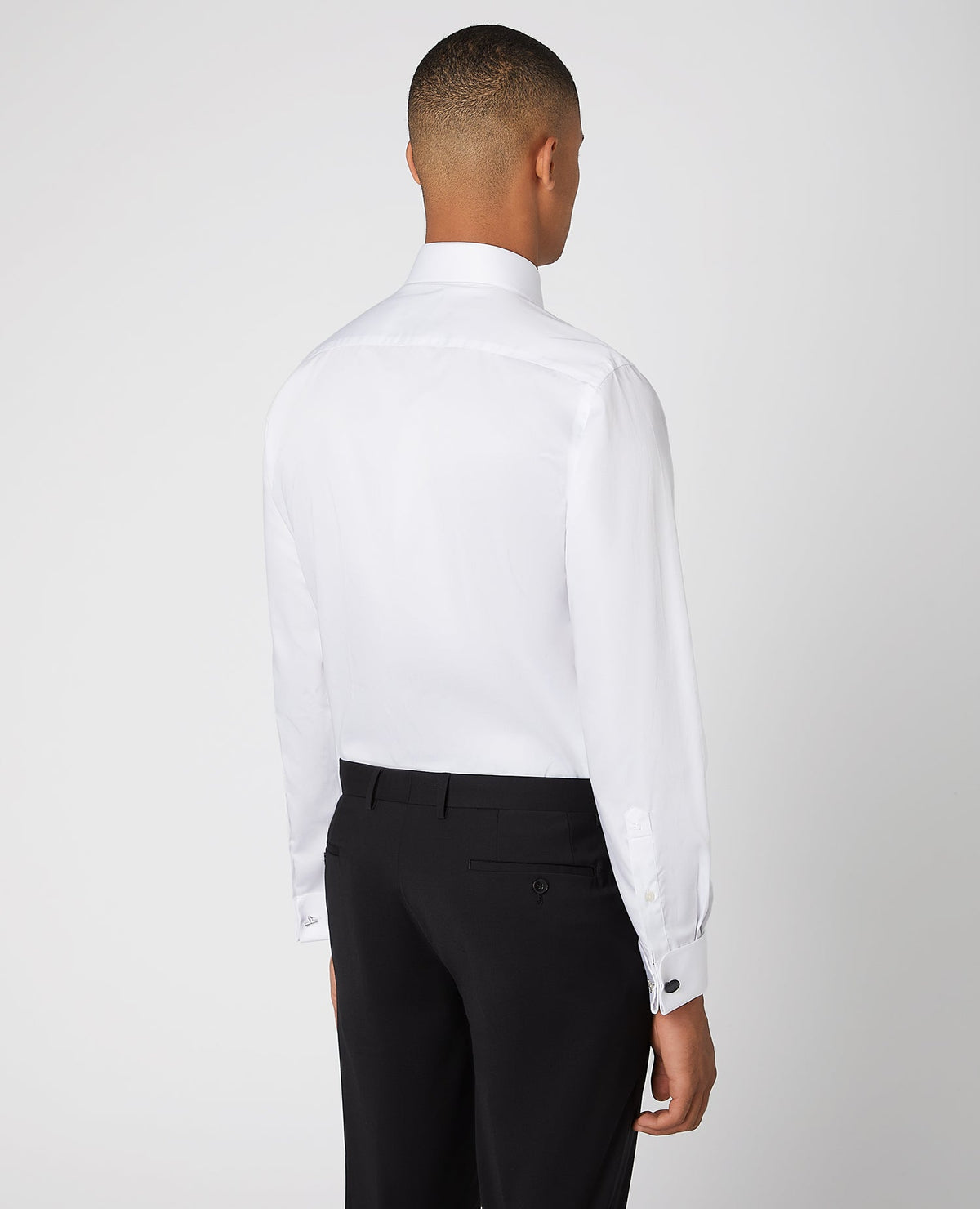 Man wearing a white Tapered Fit Cotton Evening Shirt