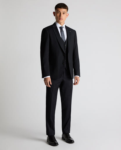 Man wearing a navy Tapered Fit Wool Rich Suit