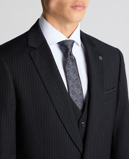Man wearing a navy Tapered Fit Wool Rich Suit