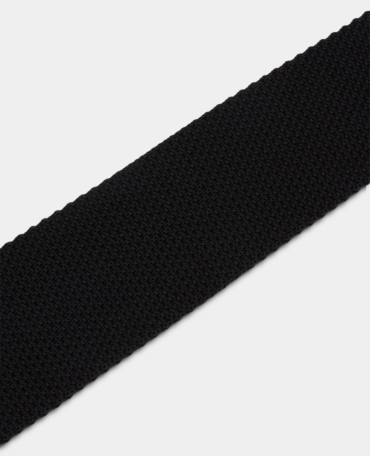 Man wearing a black Plain Knitted Narrow Tie
