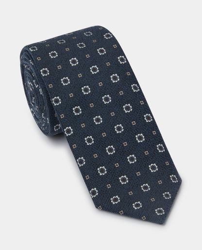 Man wearing a blue Geometric Floral Design Tie
