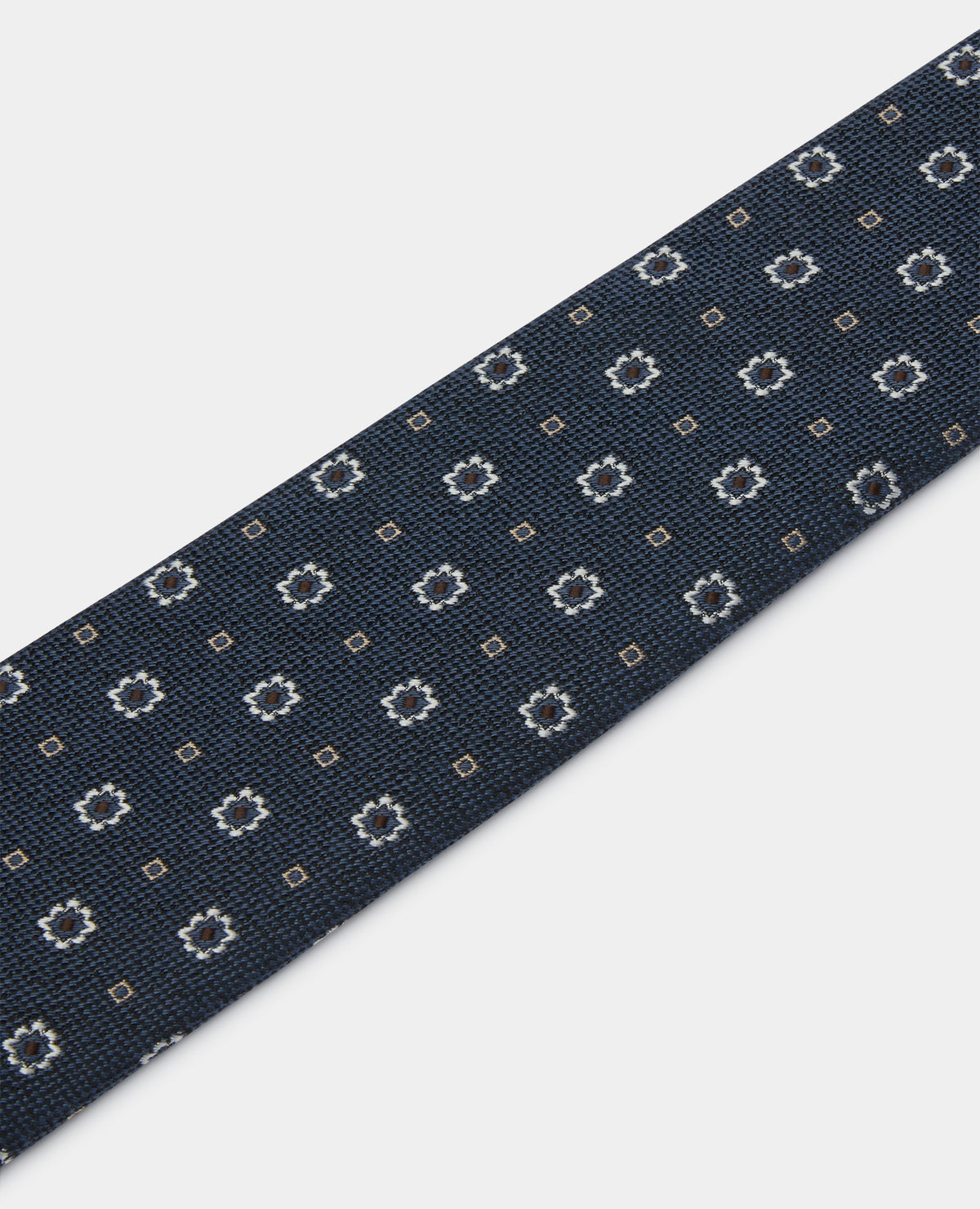 Man wearing a blue Geometric Floral Design Tie