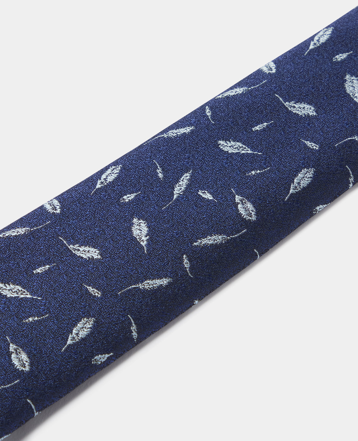 Man wearing a blue Leaf Print Tie