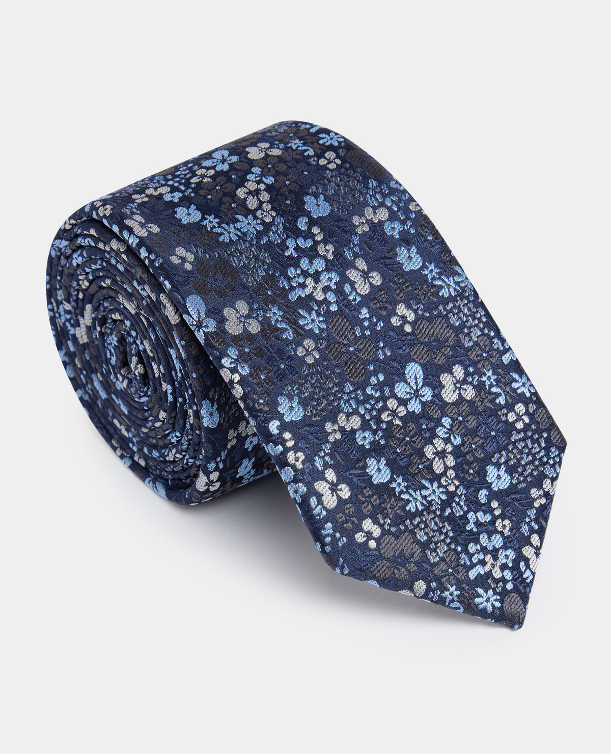 Man wearing a blue Ditsy Floral Print Tie