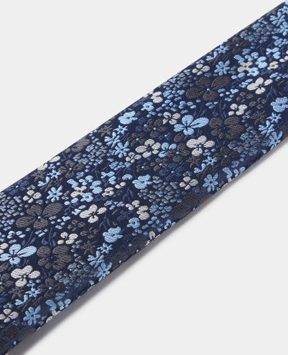 Man wearing a blue Ditsy Floral Print Tie