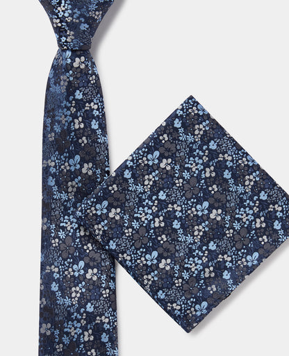 Man wearing a blue Ditsy Floral Print Tie