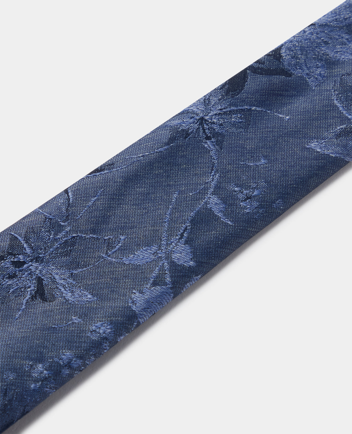 Man wearing a blue Shaded Floral Print Tie