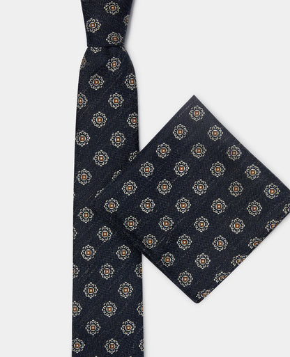 Man wearing a navy Geometric Design Tie