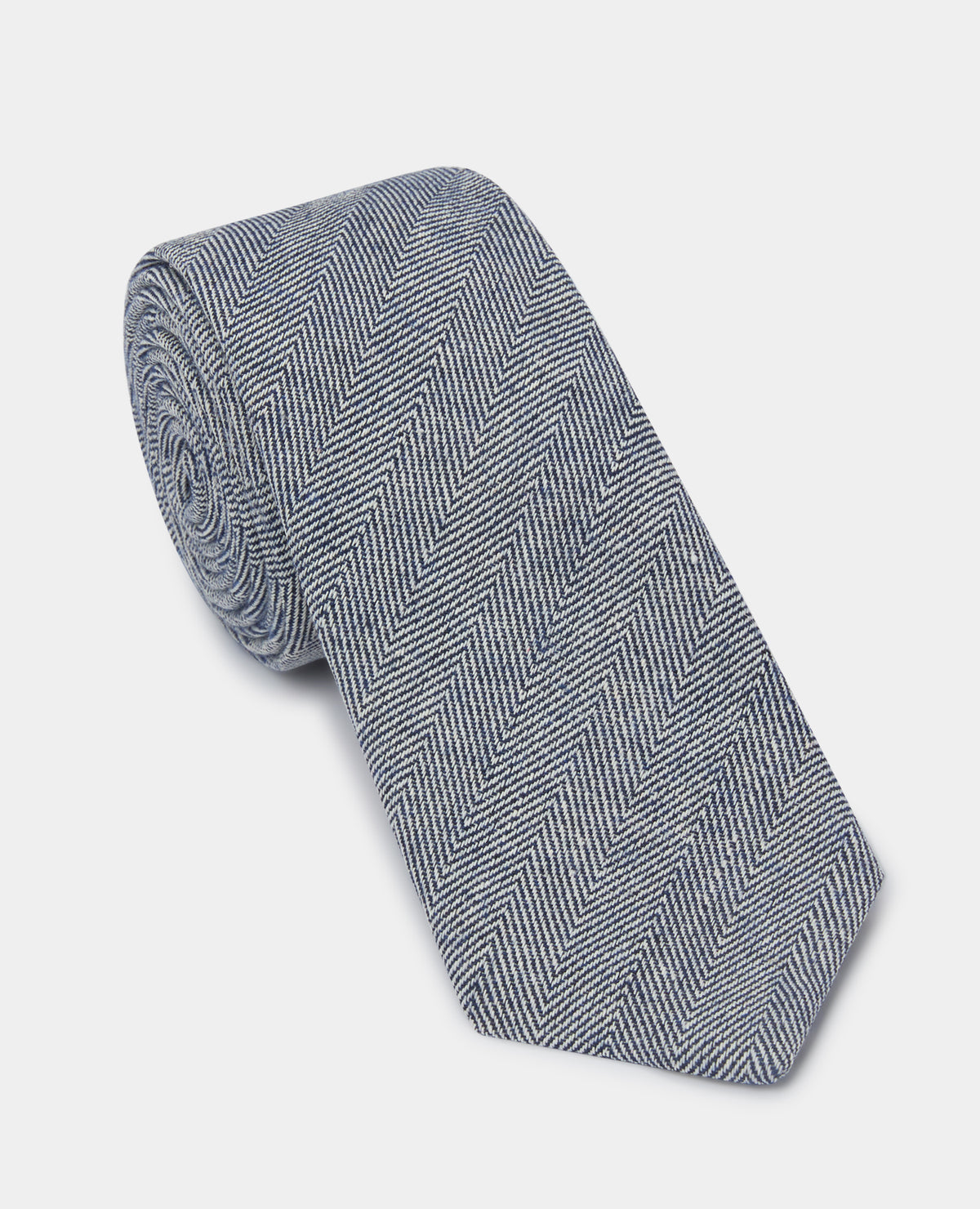 Man wearing a navy Herringbone Design Tie