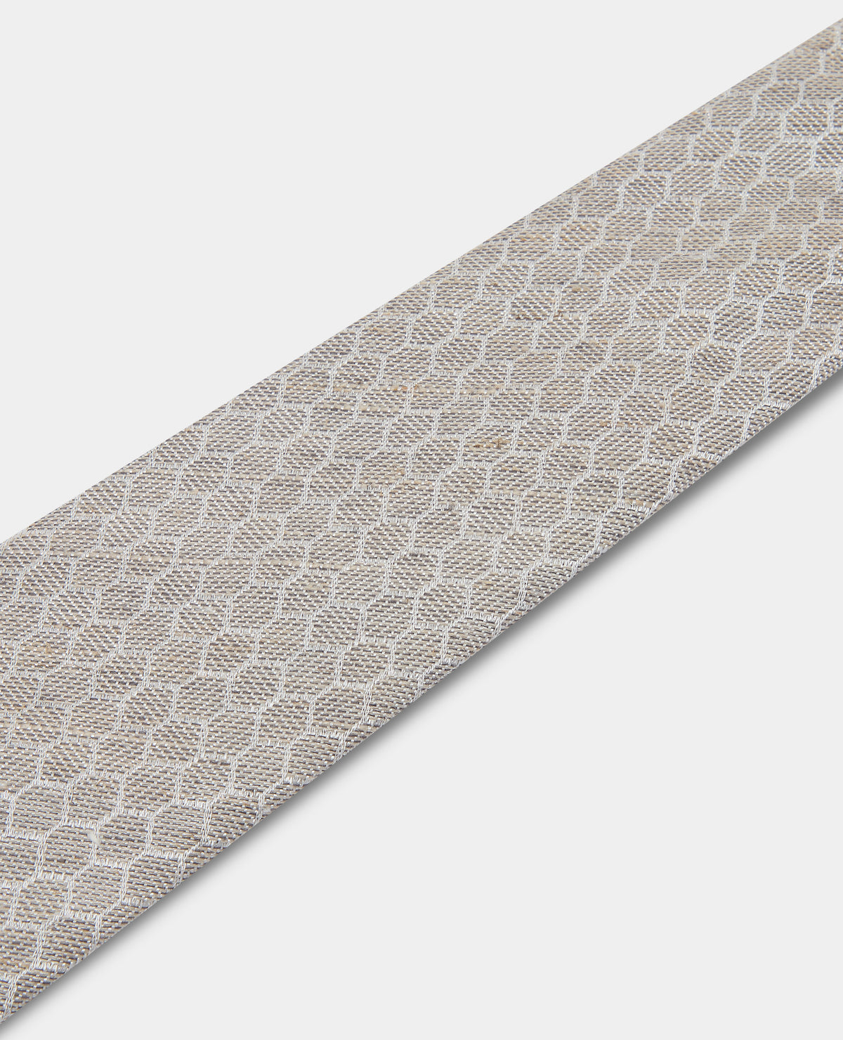 Man wearing a sand Geometric Design Tie
