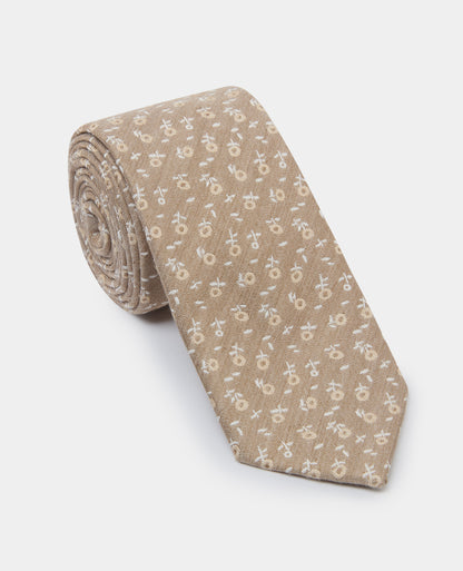 Man wearing a sand Floral Tie