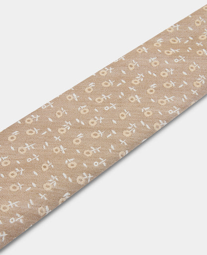 Man wearing a sand Floral Tie