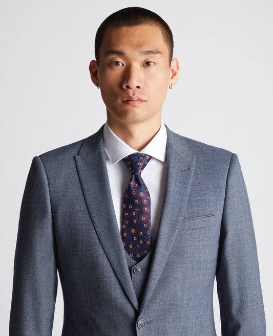 Man wearing a navy Floral Tie
