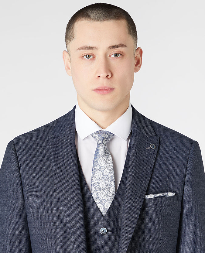 Man wearing a blue Silk Floral Tie