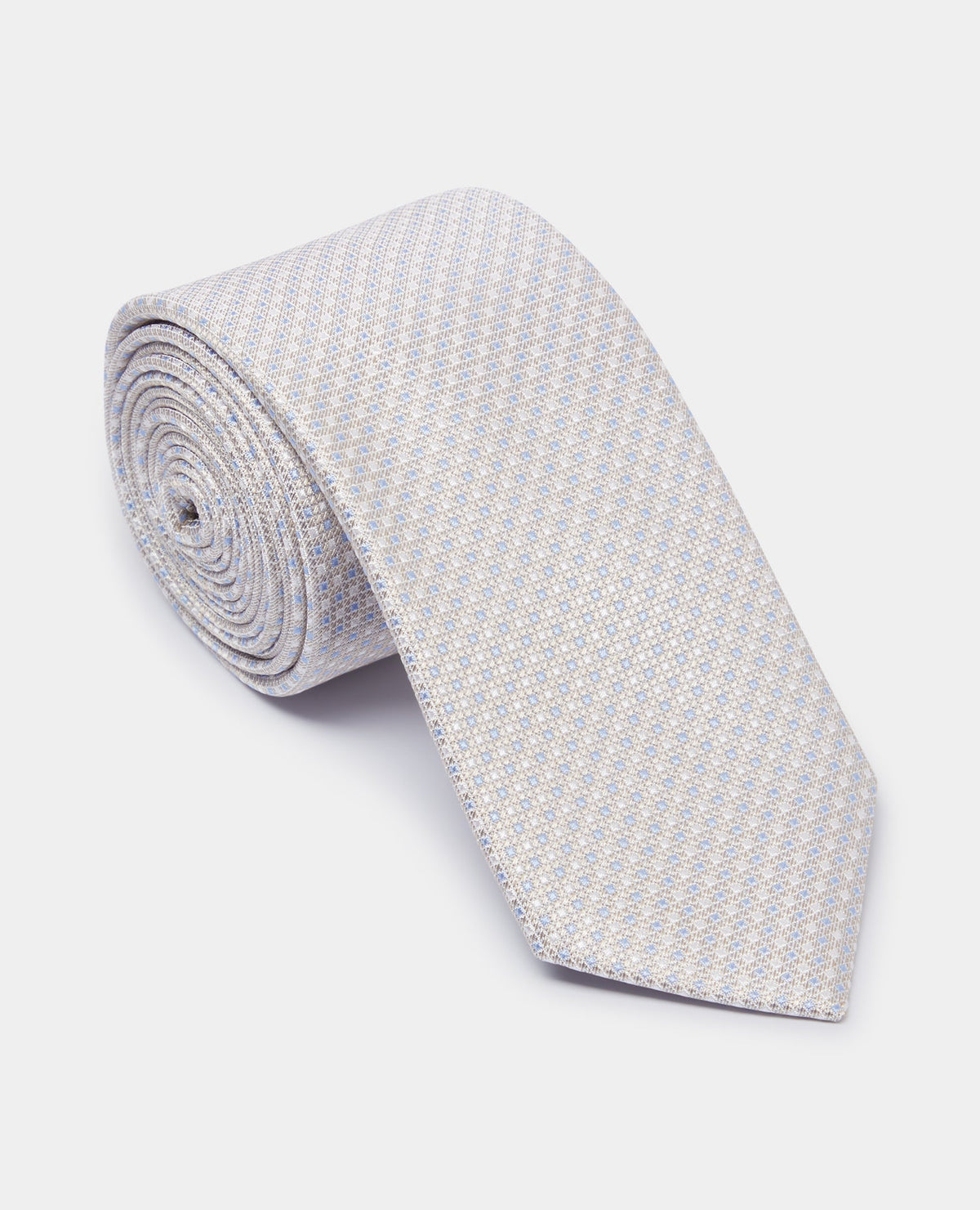 Man wearing a sand Silk Polka Dot Tie