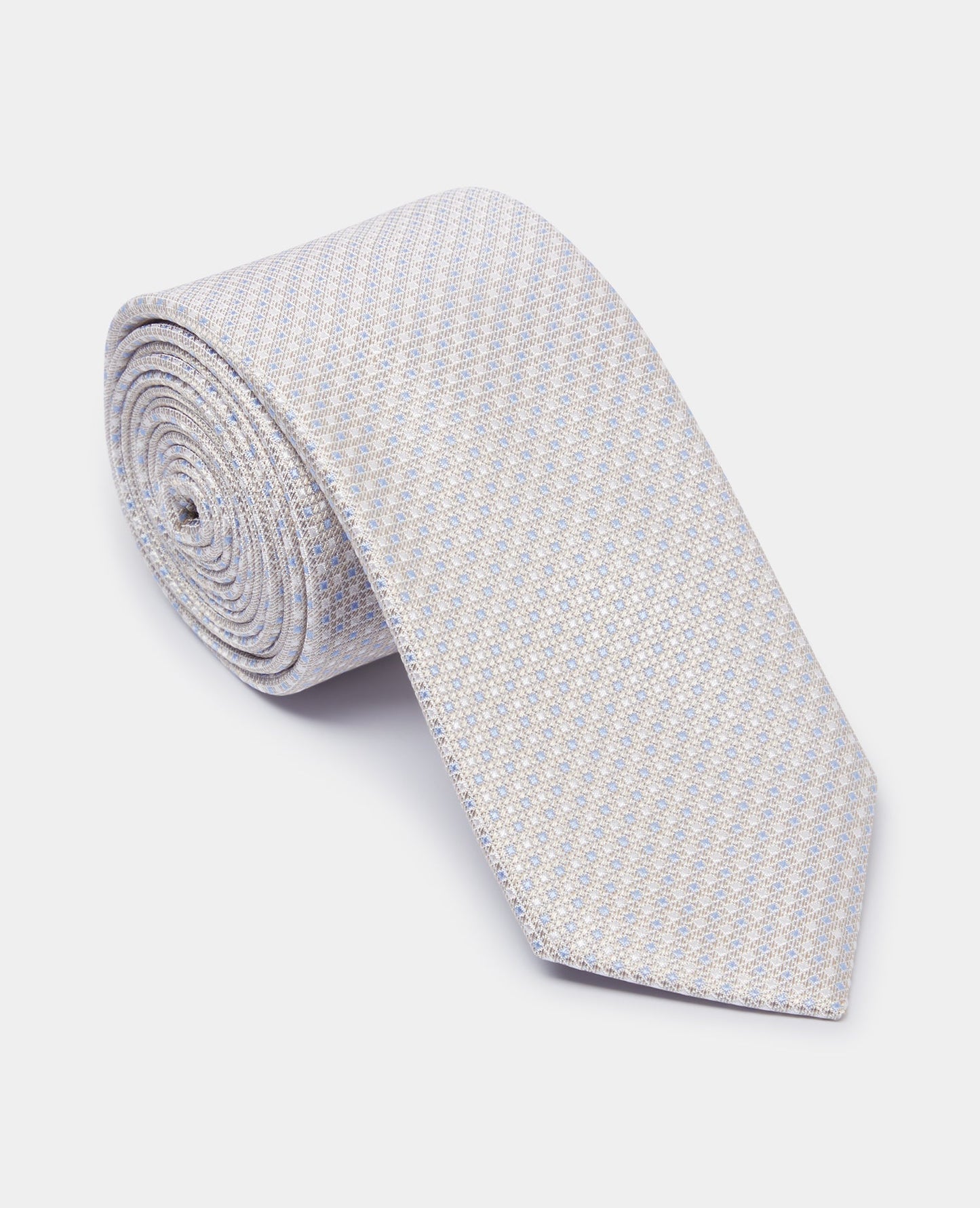 Man wearing a sand Silk Polka Dot Tie