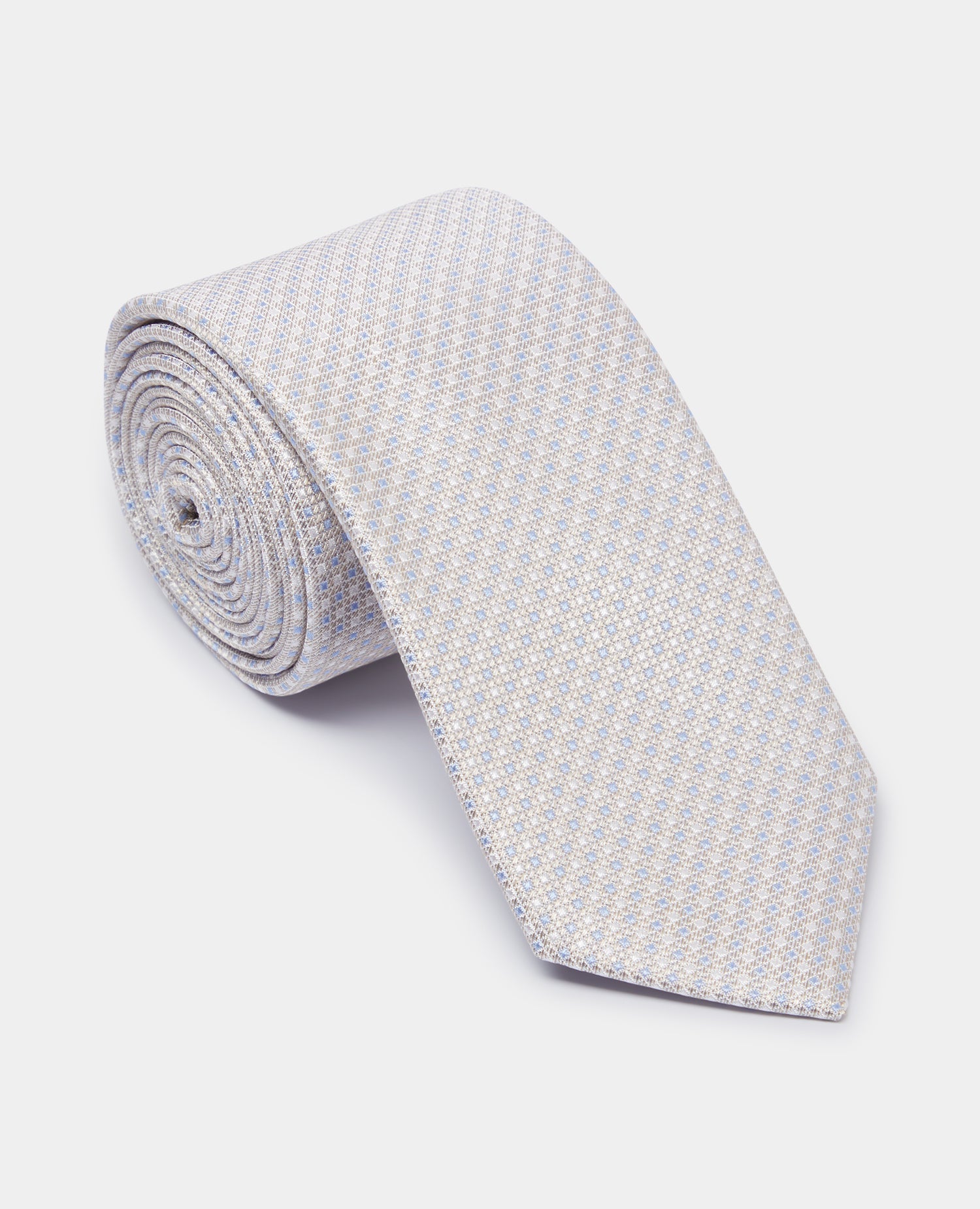 Man wearing a sand Silk Polka Dot Tie