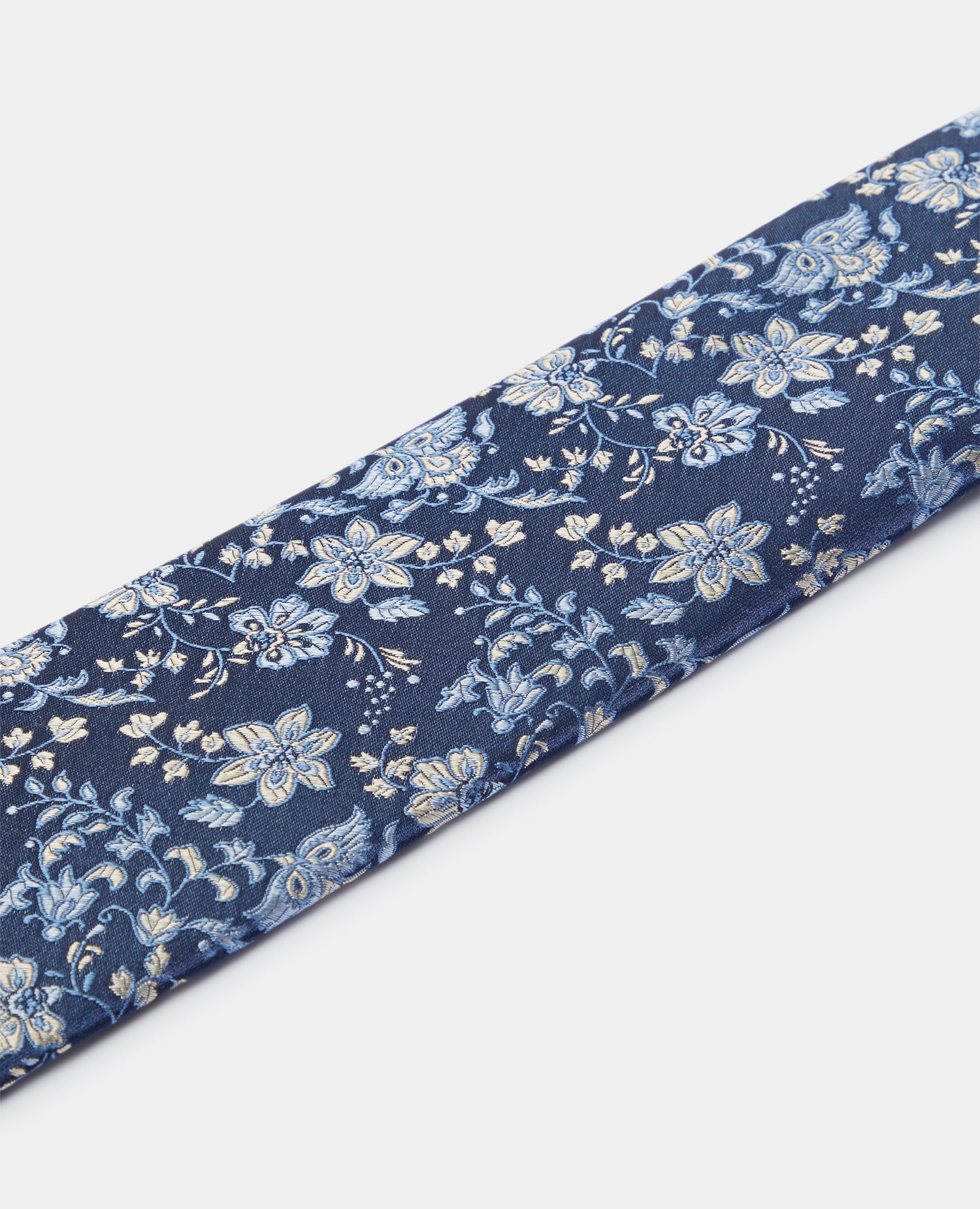 Man wearing a blue Silk Floral Tie