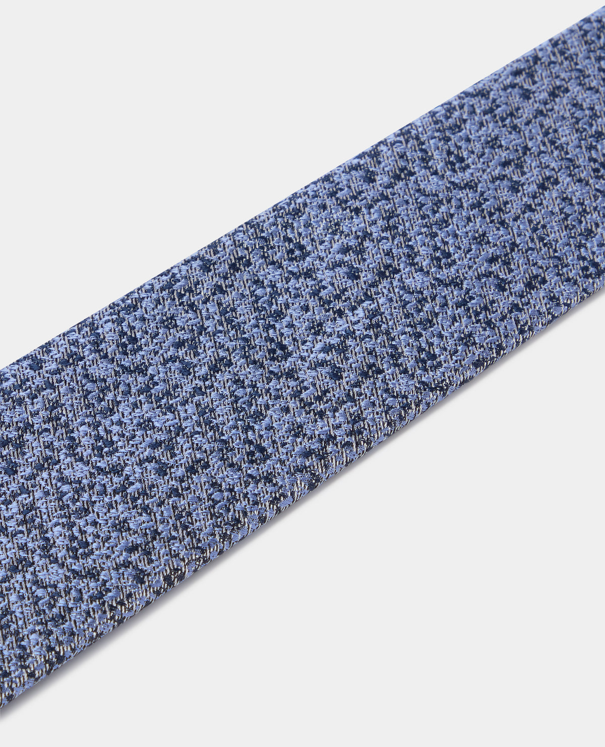 Man wearing a blue Abstract Print Silk Tie