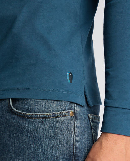 Man wearing a blue Tapered Fit Cotton-Stretch T-Shirt