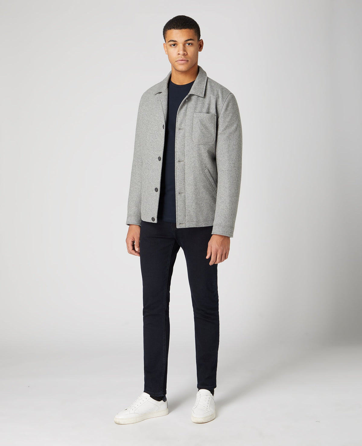 Man wearing a navy Tapered Fit Cotton-Stretch Long Sleeve T-Shirt