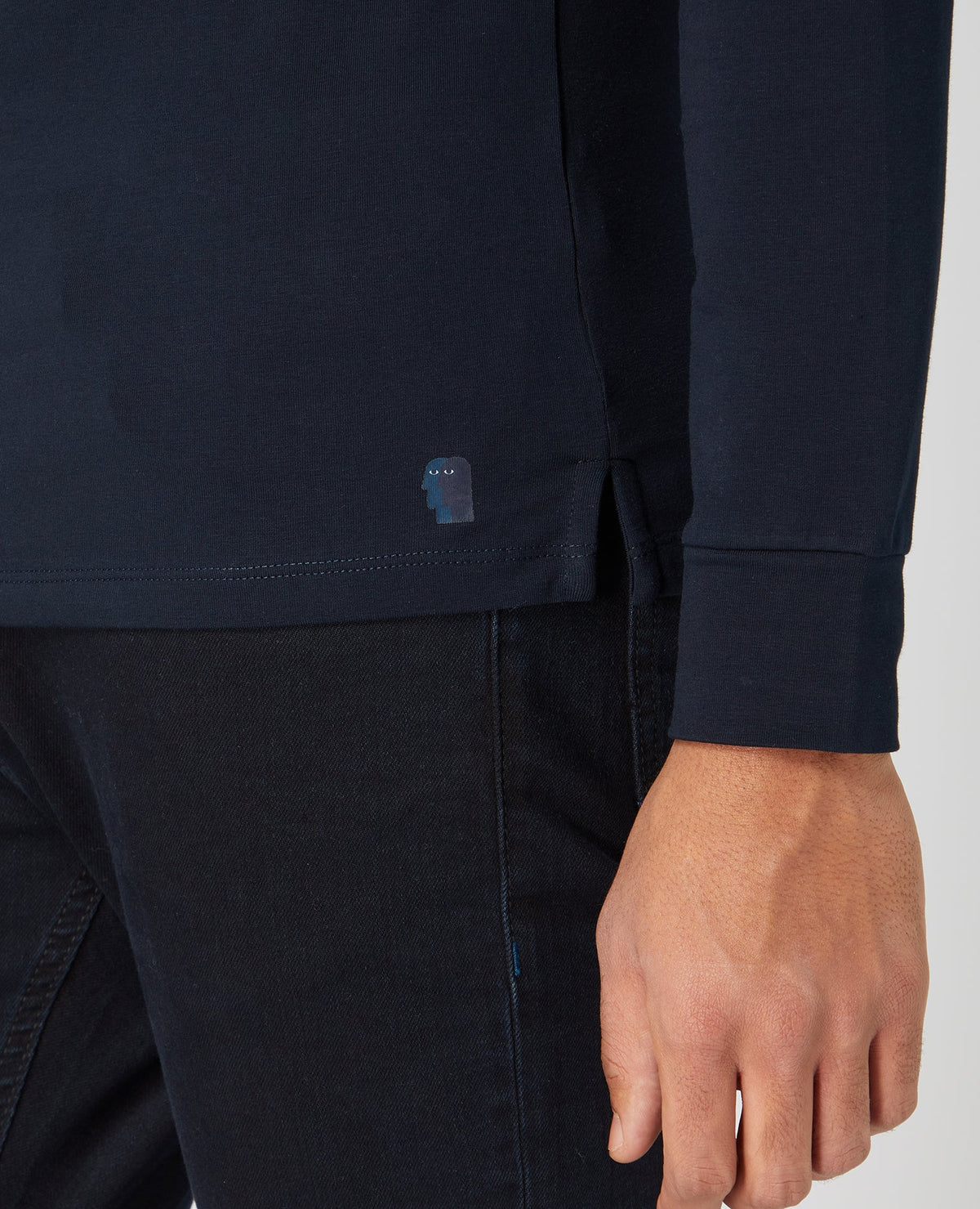 Man wearing a navy Tapered Fit Cotton-Stretch Long Sleeve T-Shirt