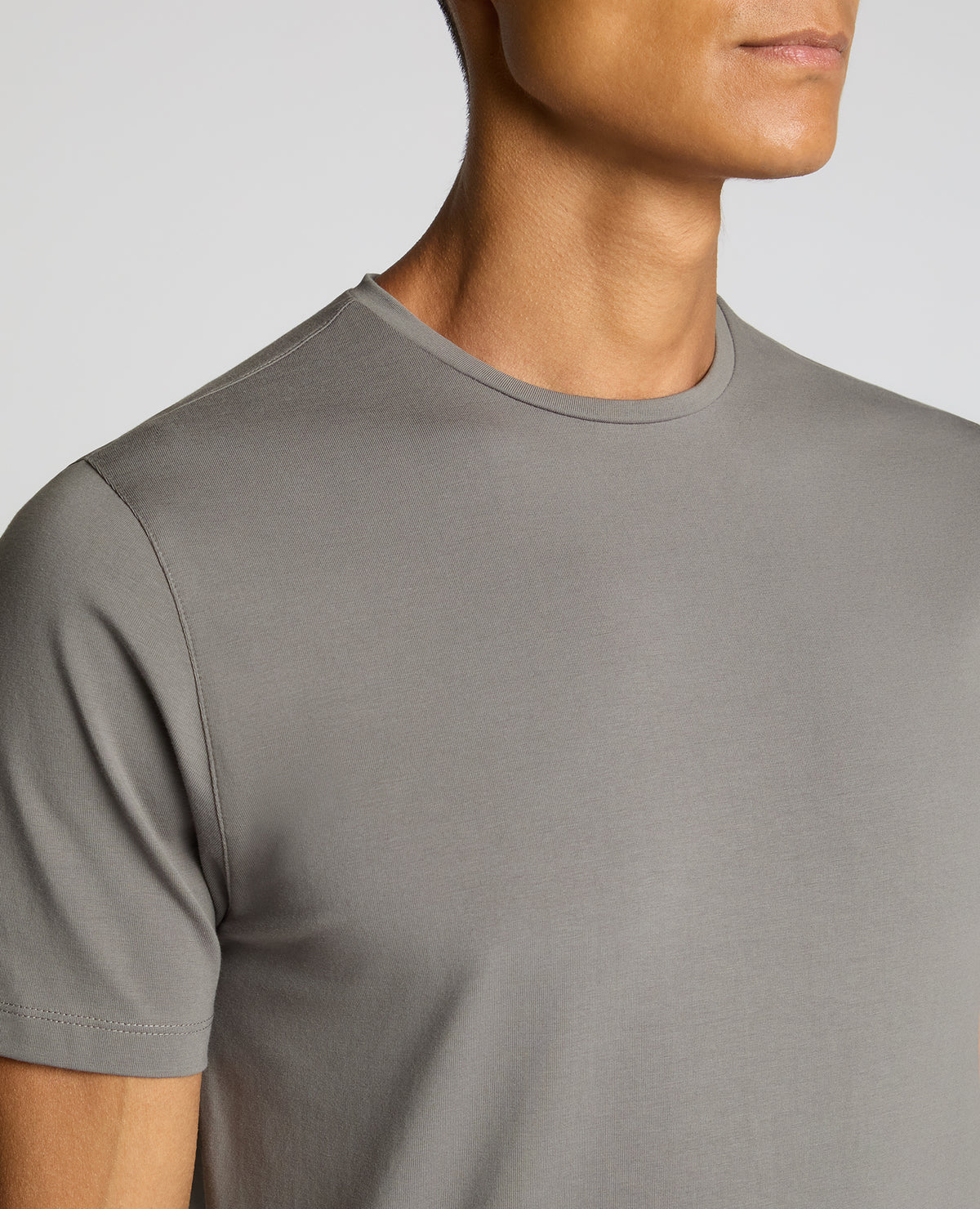 Man wearing a grey Cotton-Stretch Crew Neck T-Shirt