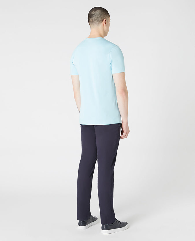 Man wearing a blue Tapered Fit Cotton-Stretch T-Shirt