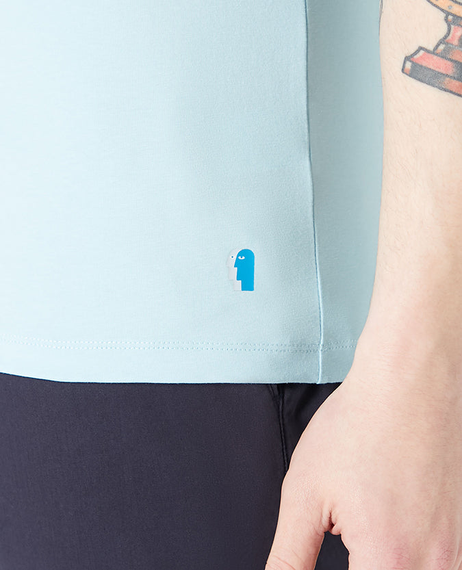 Man wearing a blue Tapered Fit Cotton-Stretch T-Shirt