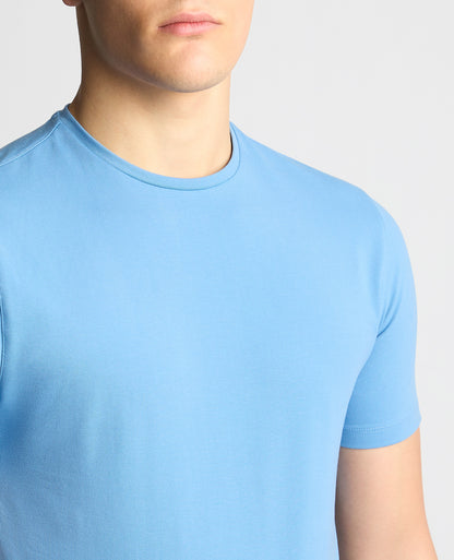 Man wearing a blue Tapered Fit Cotton-Stretch T-Shirt