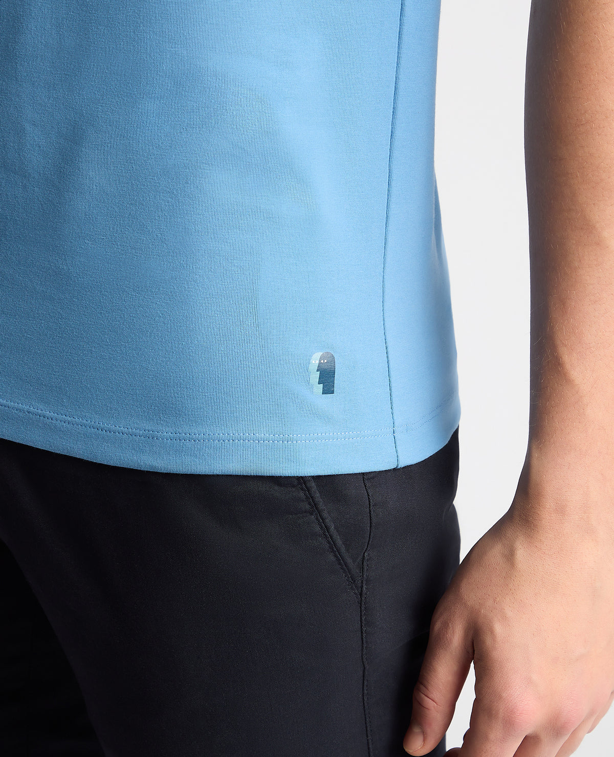 Man wearing a blue Tapered Fit Cotton-Stretch T-Shirt