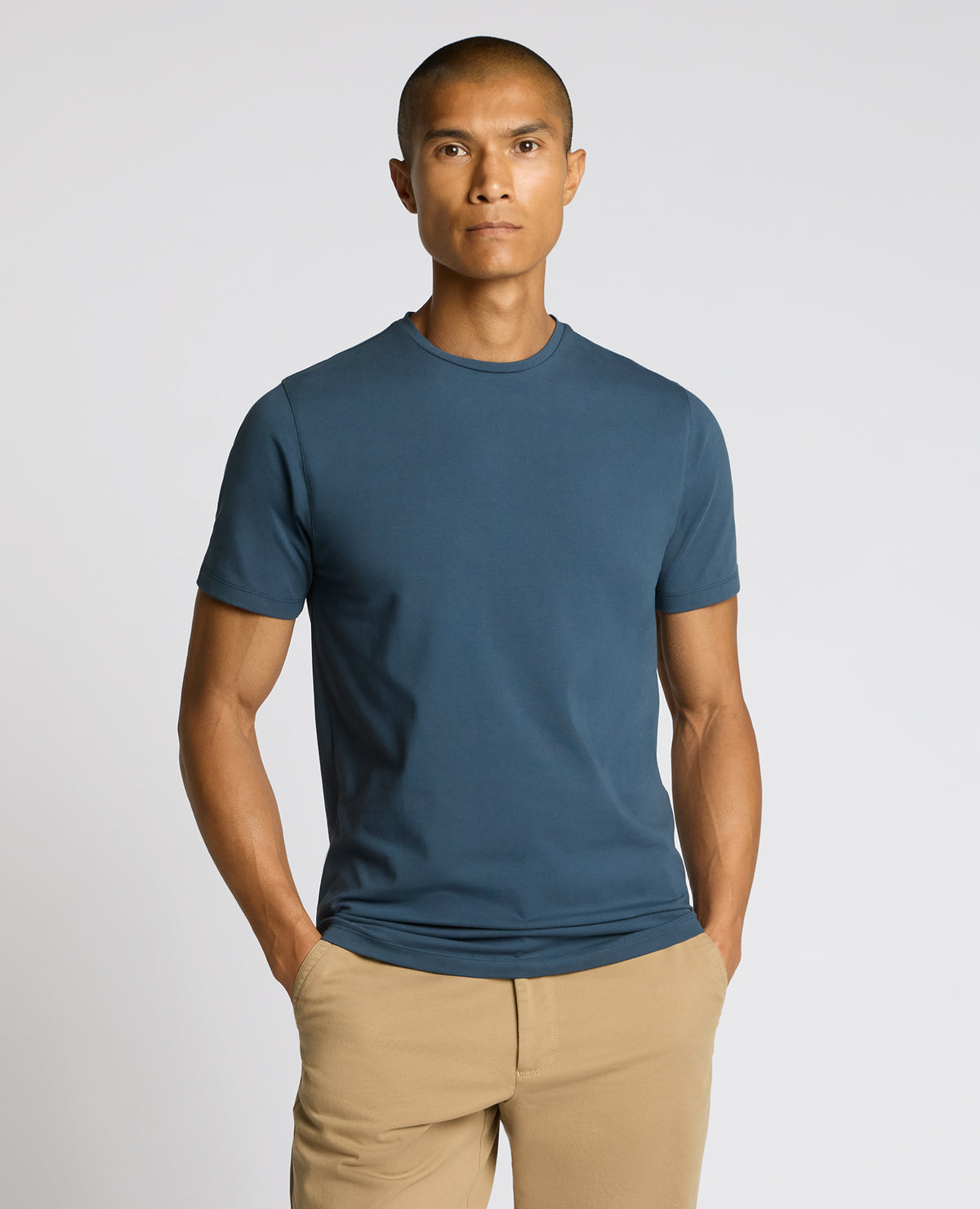 Man wearing a blue Cotton-Stretch Crew Neck T-Shirt