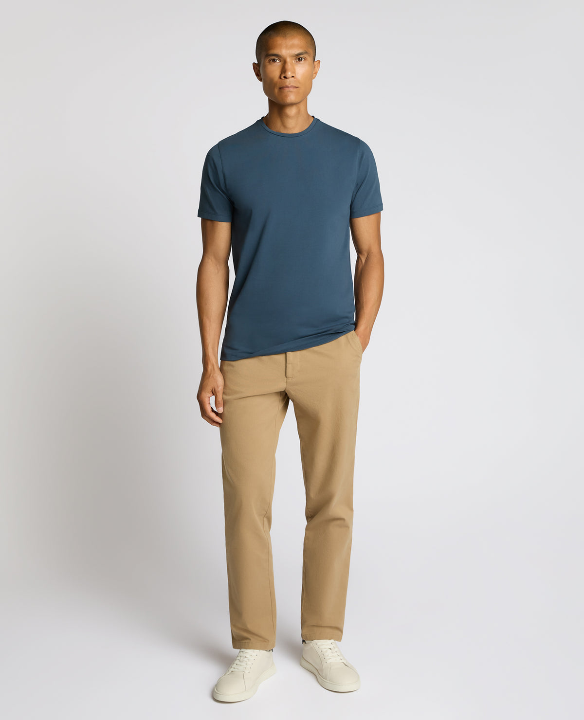 Man wearing a blue Cotton-Stretch Crew Neck T-Shirt