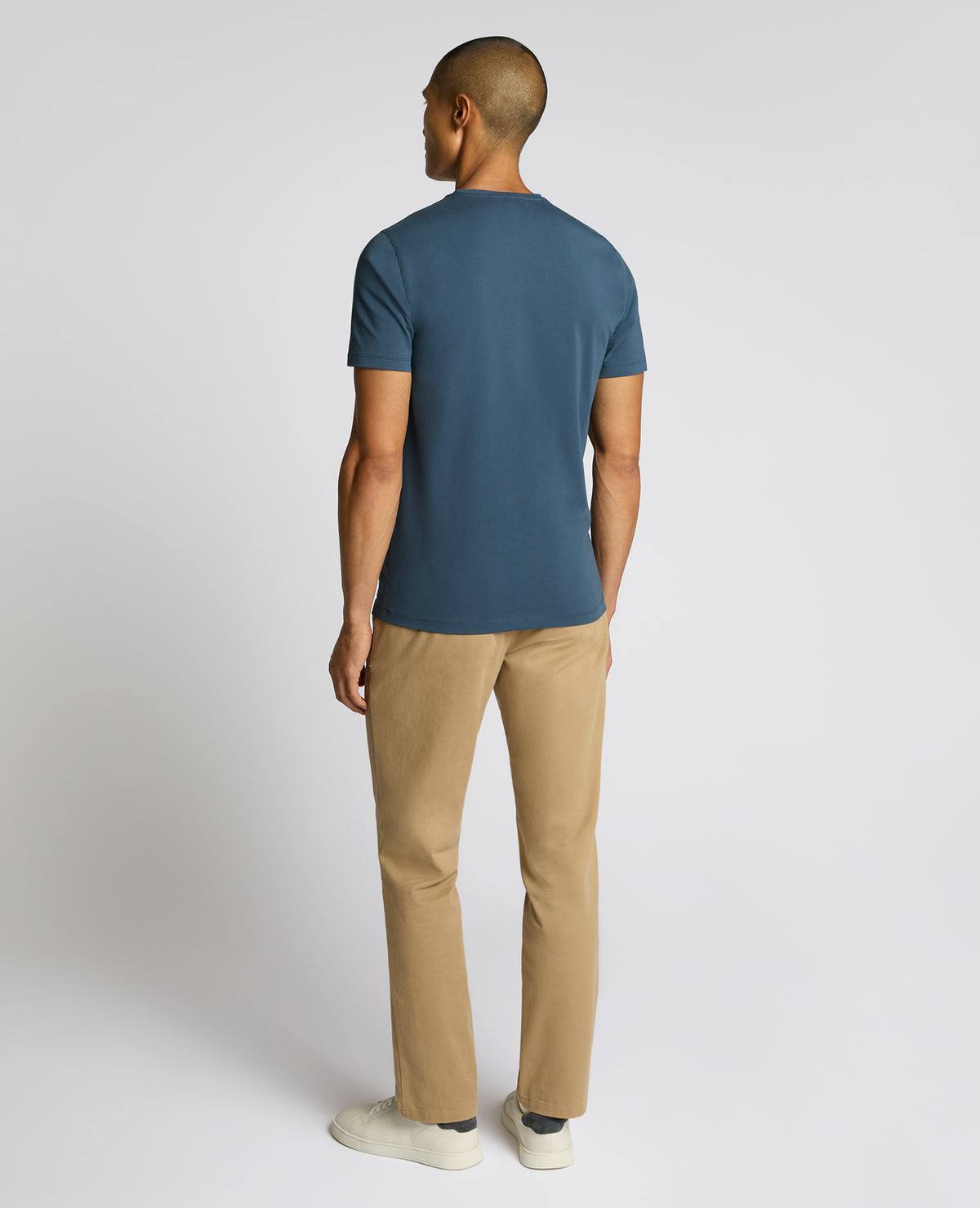 Man wearing a blue Cotton-Stretch Crew Neck T-Shirt