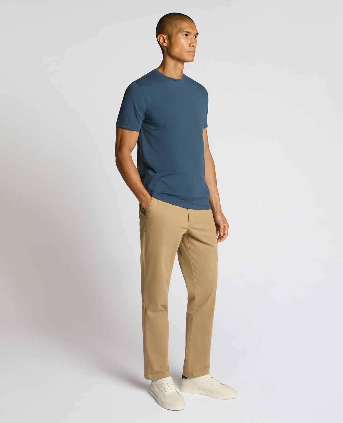 Man wearing a blue Cotton-Stretch Crew Neck T-Shirt