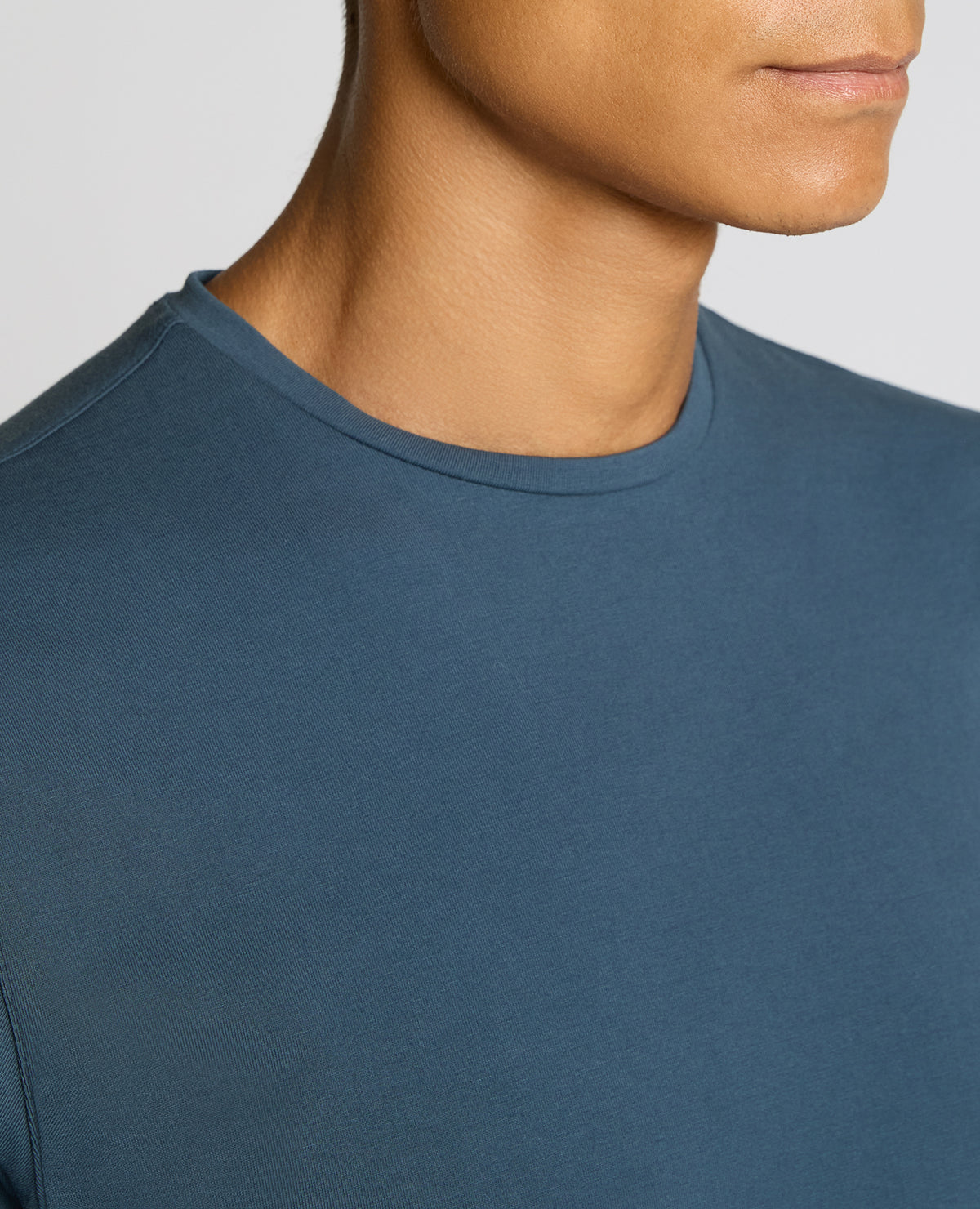 Man wearing a blue Cotton-Stretch Crew Neck T-Shirt