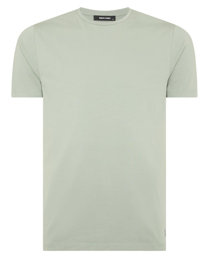 Man wearing a green Tapered Fit Cotton-Stretch T-Shirt
